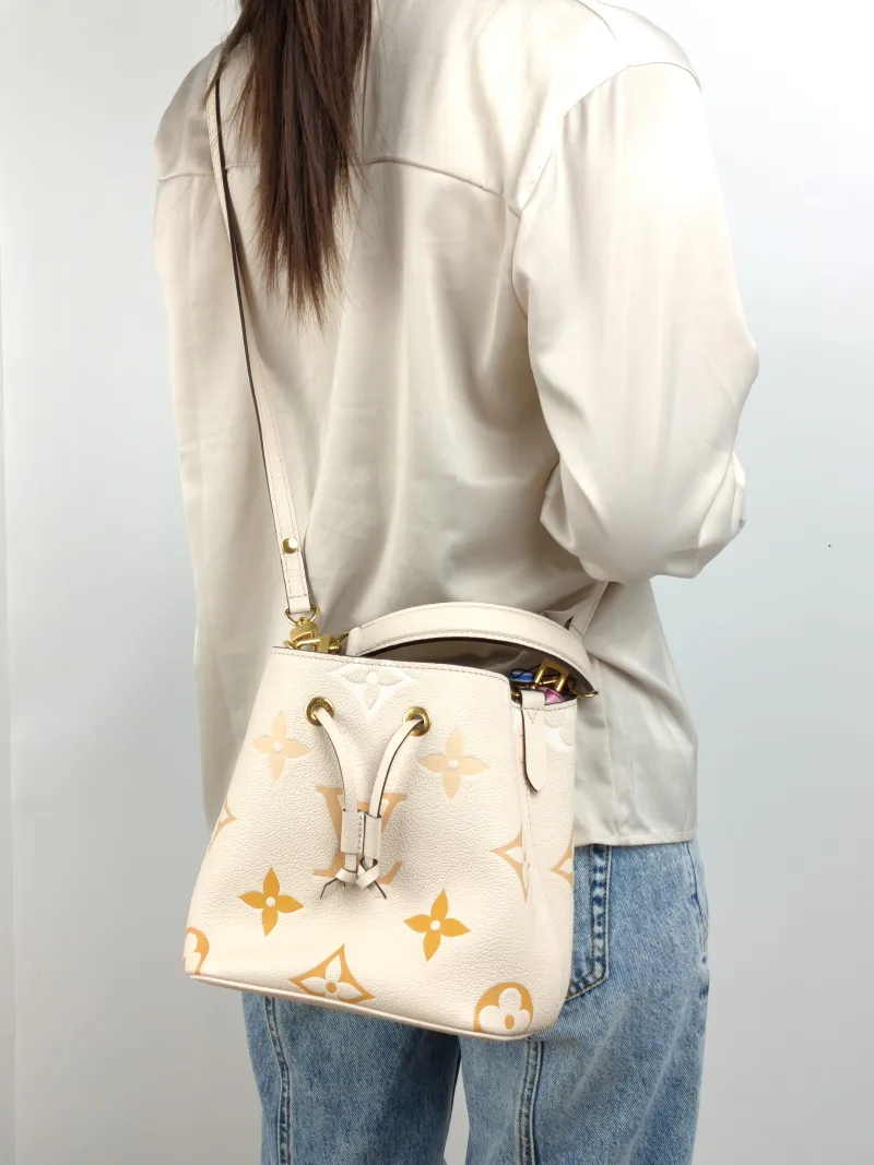 Louis Vuitton Crossbody Bag NÉONOÉ Bucket Bag BB Monogram Empreinte Embossed Calfskin BB 20 × 13 × 20 cm Conditioned — on-model view 1 of 3