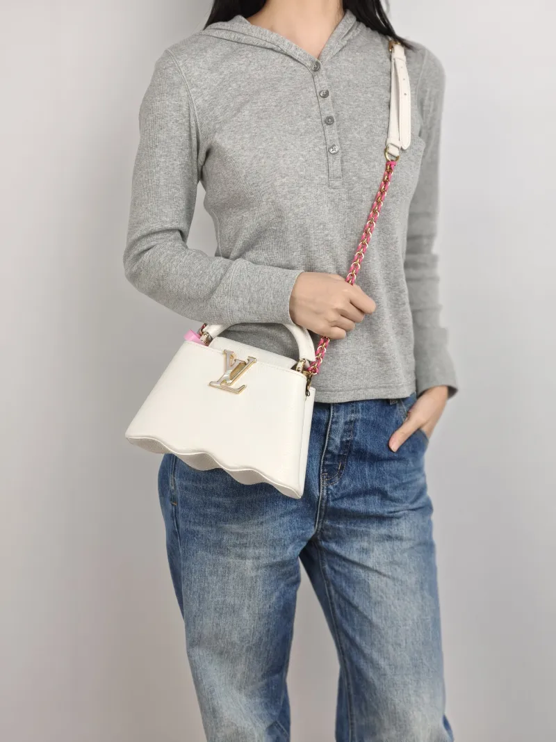 Louis Vuitton Crossbody Bag Capucines White Calfskin Mini 22 × 7.5 × 14 cm — on-model view 1 of 3