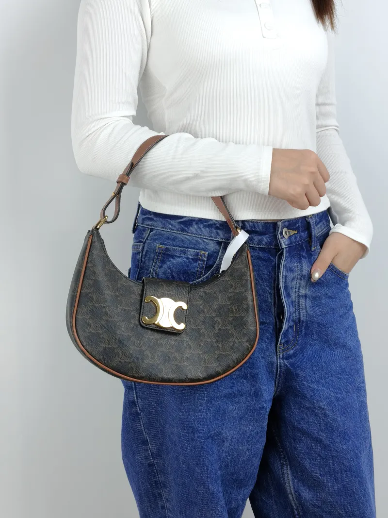 CELINE Shoulder Bag AVA TRIOMPHE Monogram PVC Medium 22 × 7.5 × 17 cm — on-model view 1 of 2