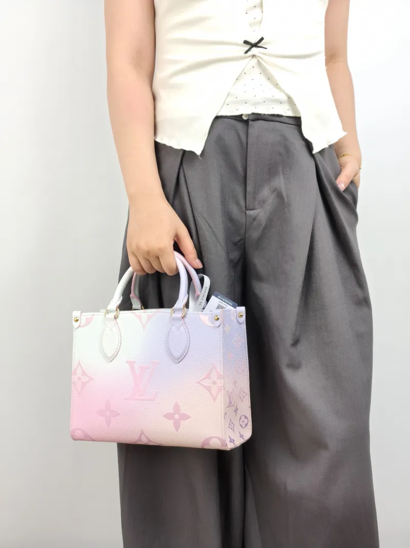 Louis Vuitton Top Handle Bag Onthego Calfskin Small 25 × 11.5 × 19 cm — on-model view 1 of 3