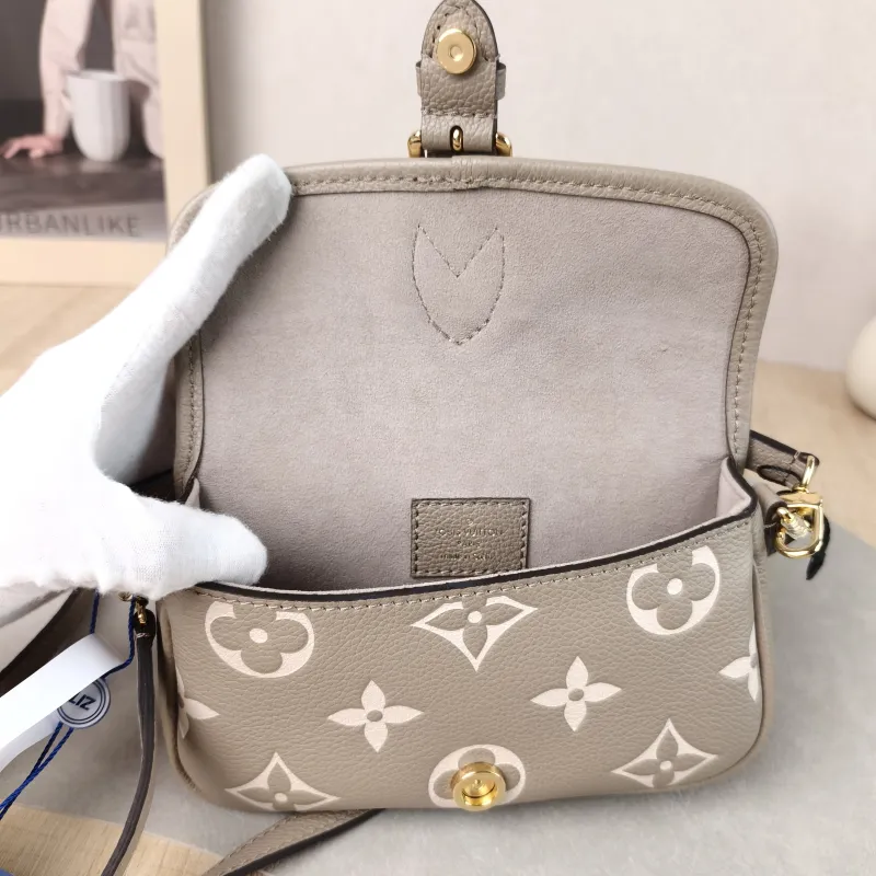 Louis Vuitton Crossbody Bag Diane Baguette Bag Empreinte Embossed Calfskin nano 19 × 6 × 10.5 cm — detail view 8 of 14