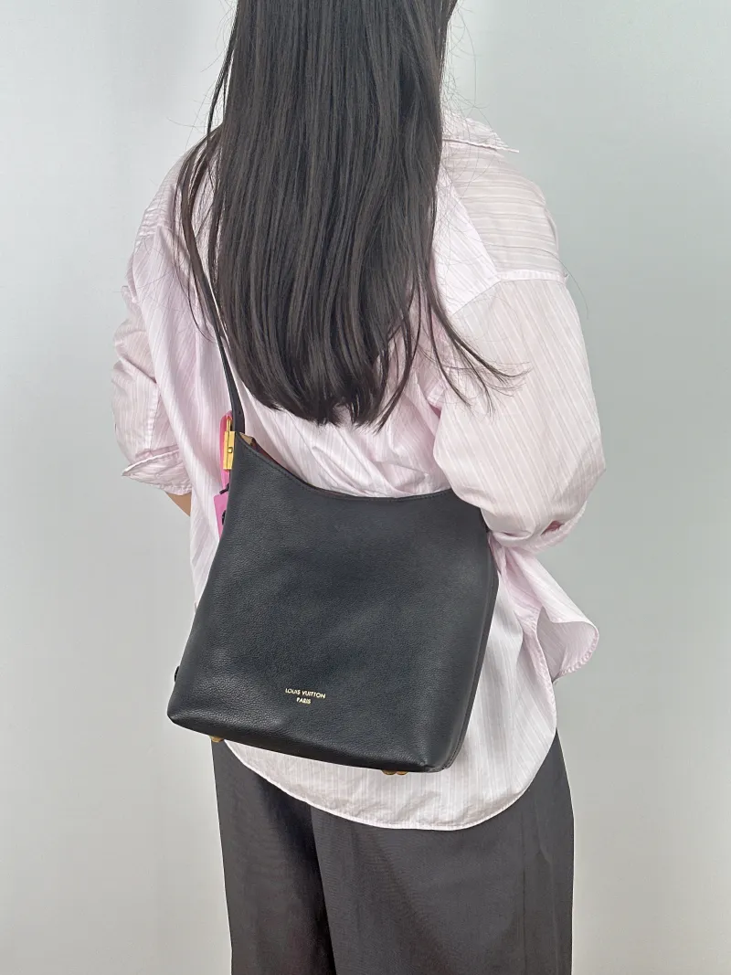 Louis Vuitton Shoulder Bag Low Key Hobo Shoulder Bag Black Calfskin Small 24 × 16 × 28 cm — on-model view 1 of 2