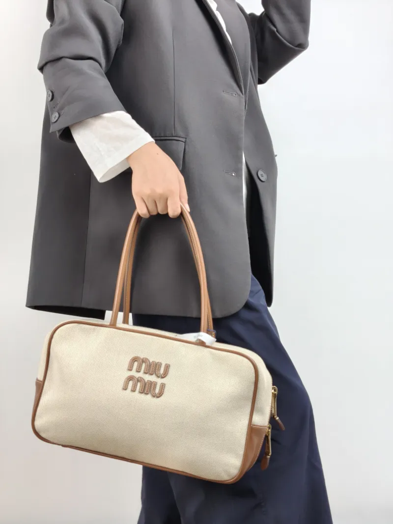 Miumiu Top Handle Bag Beau Brown Canvas · Calfskin Large 34 × 10 × 20 cm — on-model view 1 of 2