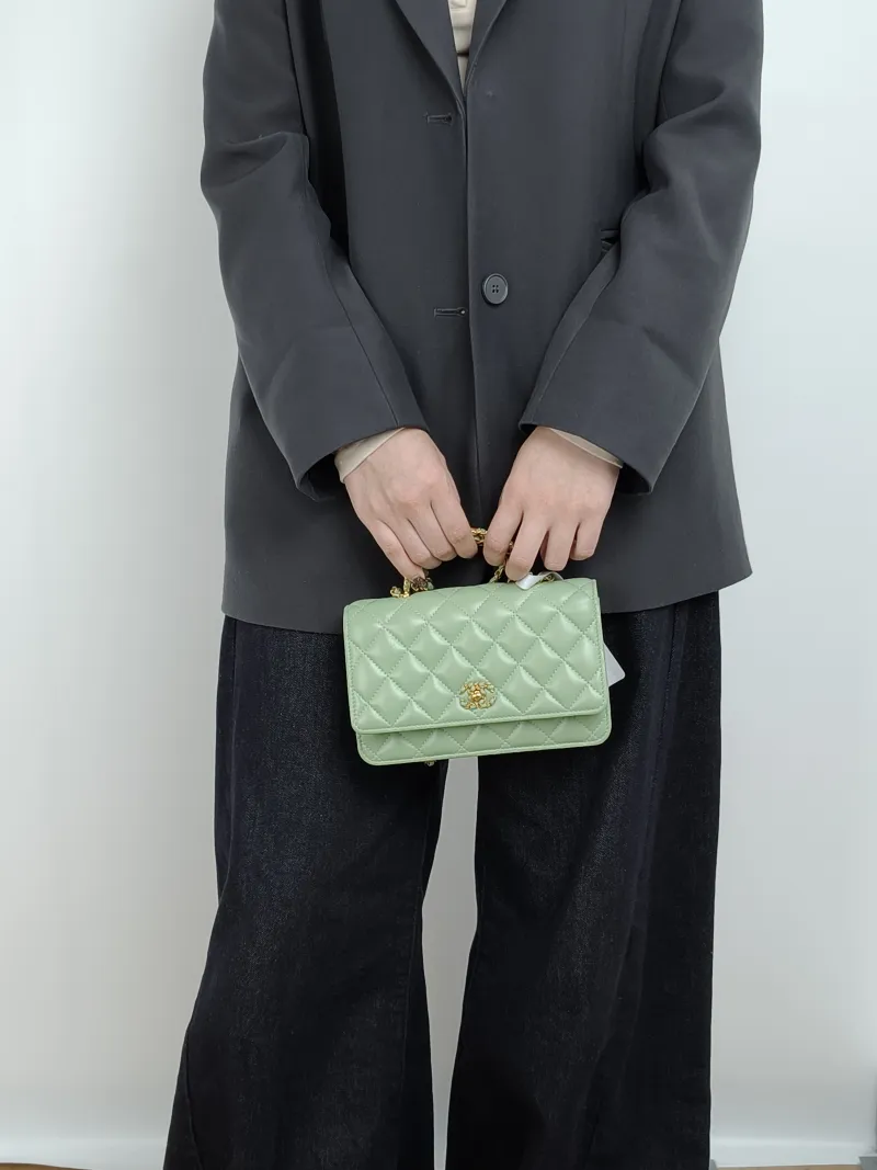 Chanel Crossbody Bag Edition woc Green Lambskin Mini 19.2 × 3.5 × 12.3 cm — on-model view 1 of 3