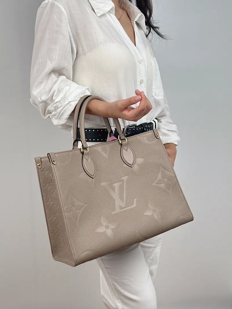 Louis Vuitton Shoulder Bag Onthego Medium Monogram Empreinte Embossed Calfskin Medium 35 × 14 × 27 cm — on-model view 1 of 3