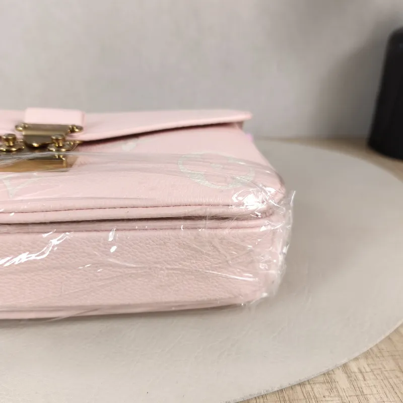 Louis Vuitton Crossbody Bag Pochette Métis East West Monogram Empreinte Embossed Calfskin Small 21.5 × 6 × 13.5 cm — detail view 9 of 12