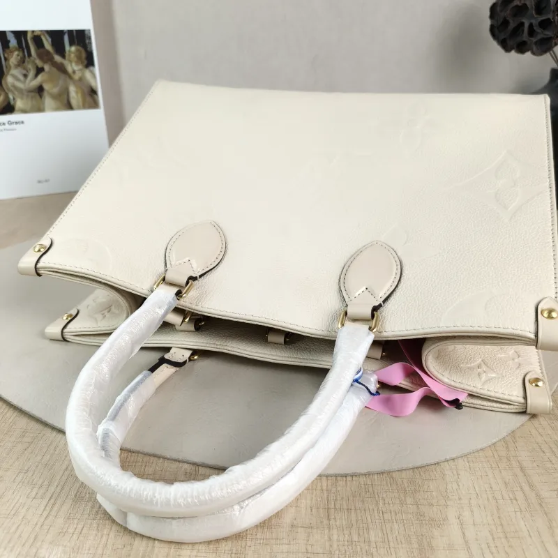 Louis Vuitton Shoulder Bag Onthego Medium White Empreinte Embossed Calfskin Medium 35 × 14 × 27 cm — detail view 11 of 12