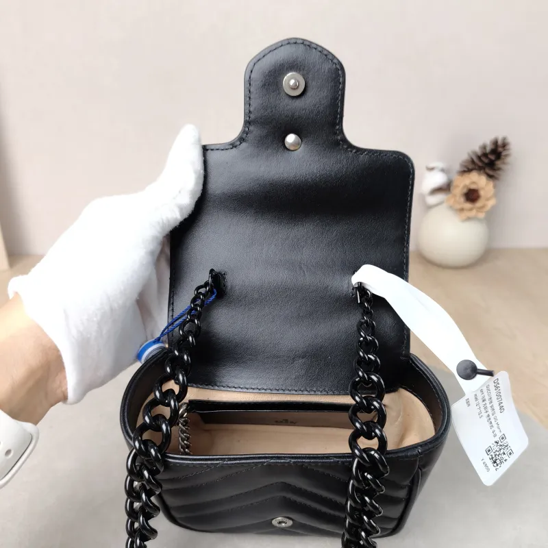 GUCCI Crossbody Bag GG Marmont Marmont Black Calfskin Mini 12 × 7 × 12.5 cm — detail view 10 of 11