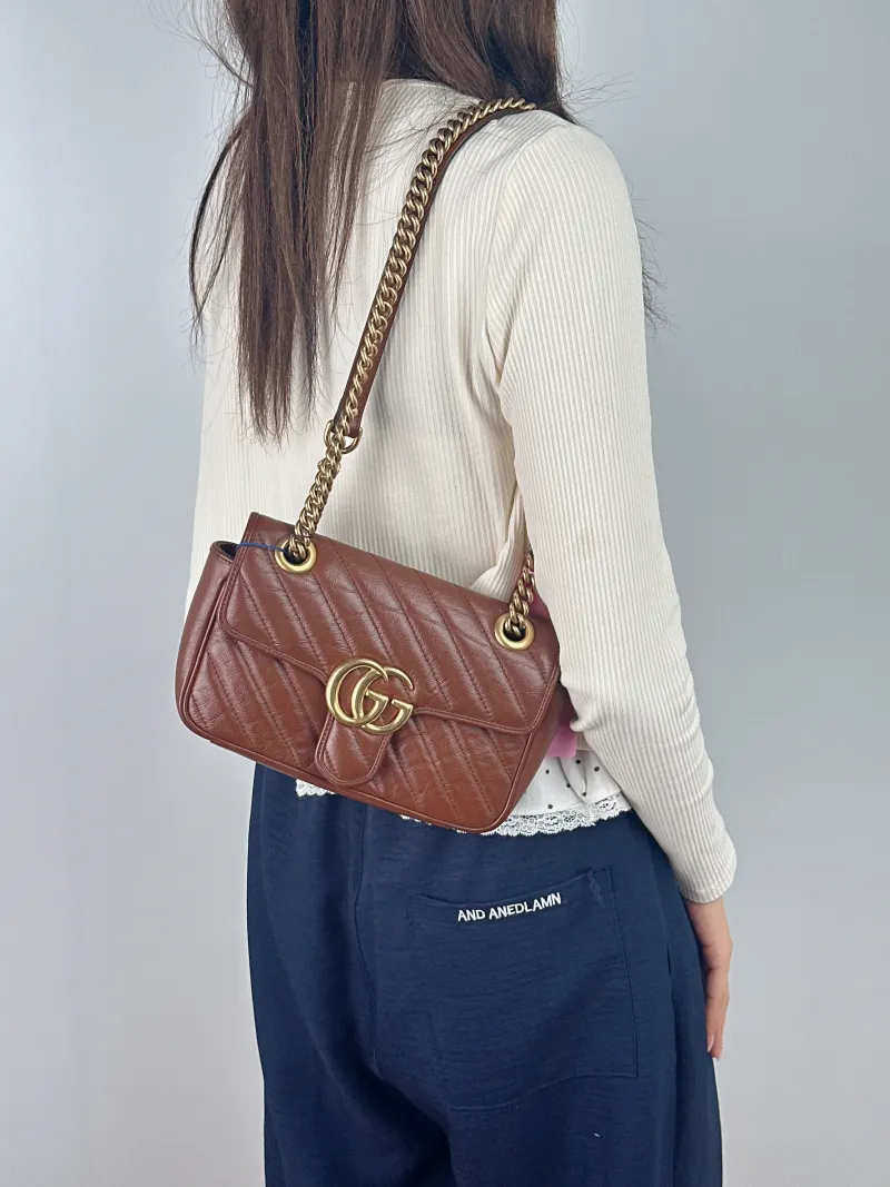GUCCI Crossbody Bag GG Marmont Small Marmont 22 Caramel Calfskin Small 22 × 6 × 13 cm — on-model view 1 of 2