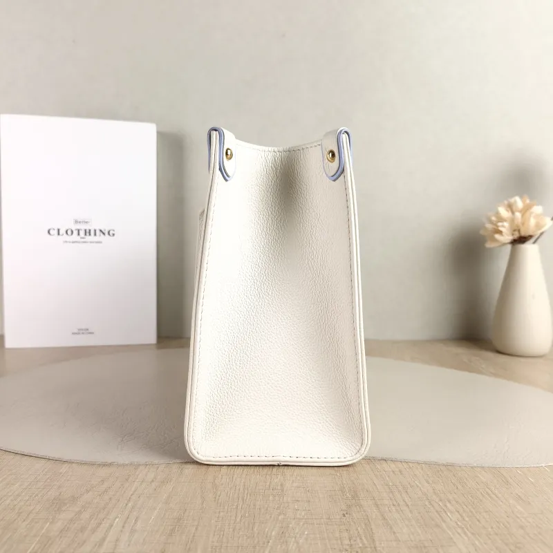 Louis Vuitton Shoulder Bag Onthego White · Blue Monogram Empreinte Embossed Calfskin Small 25 × 11.5 × 19 cm — detail view 3 of 11