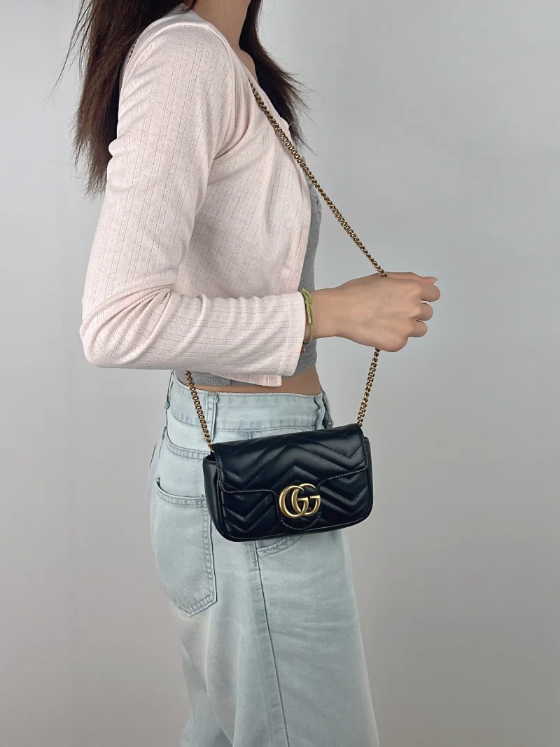 GUCCI Crossbody Bag GG Marmont Mini Marmont Mini Black Calfskinmini16.5 × 4.5 × 9.5 cm — on-model view 1 of 2