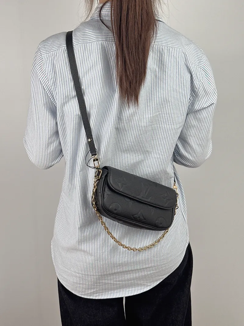 Louis Vuitton Crossbody Bag IVY Black Empreinte Embossed Calfskin Small 23.5 × 4.3 × 12 cm — on-model view 2 of 2