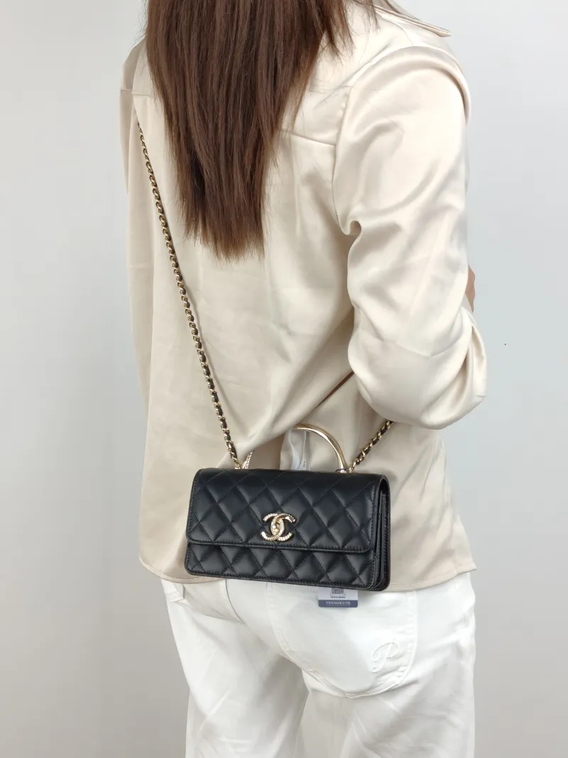 Chanel Crossbody Bag woc Black Lambskin 19 × 4 × 11.5 cm — on-model view 1 of 3
