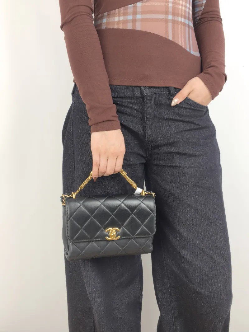 Chanel Crossbody Bag Crossbody Bag Black with Gold-Tone Hardware Lambskin Mini 20 × 6.5 × 13 cm — on-model view 2 of 3