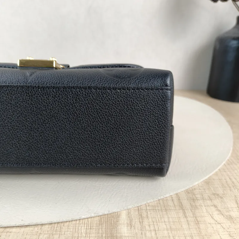 Louis Vuitton Crossbody Bag MADELEINE Black Empreinte Embossed Calfskin BB 24 × 8.5 × 17 cm — detail view 6 of 15