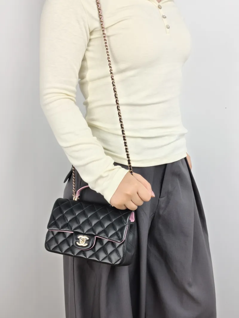 Chanel Crossbody Bag mini Black · Pink Lambskin mini 20 × 6 × 12 cm — on-model view 1 of 3