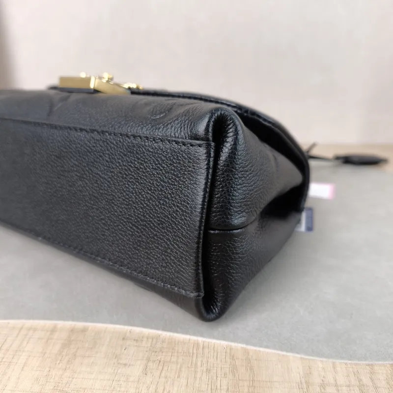 Louis Vuitton Crossbody Bag MADELEINE Black Monogram Empreinte Embossed Calfskin BB 24 × 8.5 × 17 cm — detail view 1 of 12