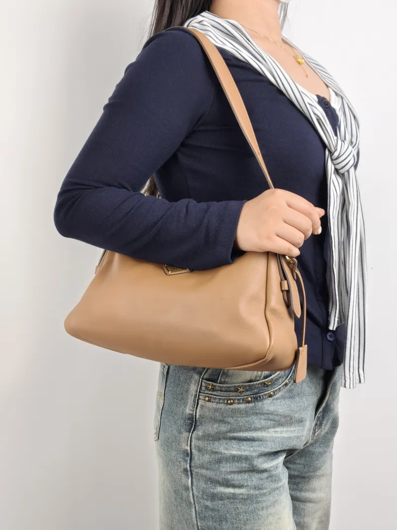 PRADA Shoulder Bag Aimée Brown Calfskin 31 × 9.5 × 18 cm — on-model view 2 of 2