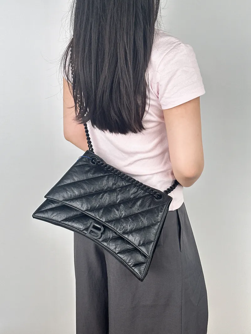 BALENCIAGA Shoulder Bag CRUSH Chain Bag Black Calfskin Medium30 × 13 × 20 cm — on-model view 2 of 2