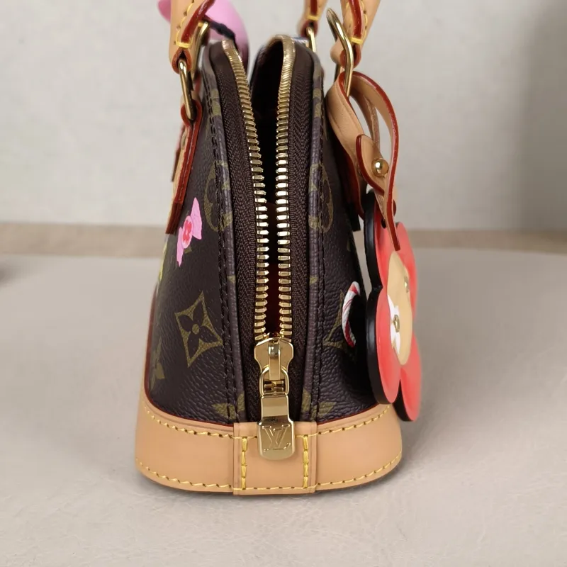 Louis Vuitton Crossbody Bag Alma Nano vivenne Monogram PVC nano 18 × 8 × 12 cm — detail view 4 of 11