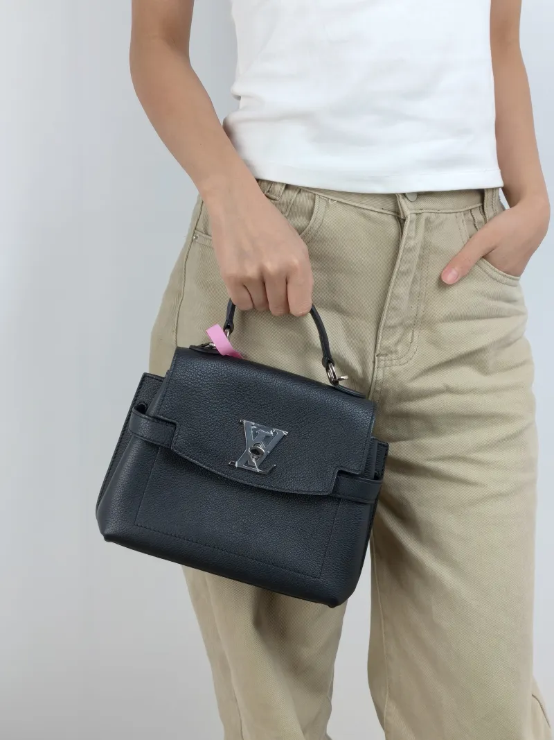 Louis Vuitton Crossbody Bag Lockme Ever Top Handle Bag Black Calfskin Mini 23 × 10 × 17 cm — on-model view 1 of 3