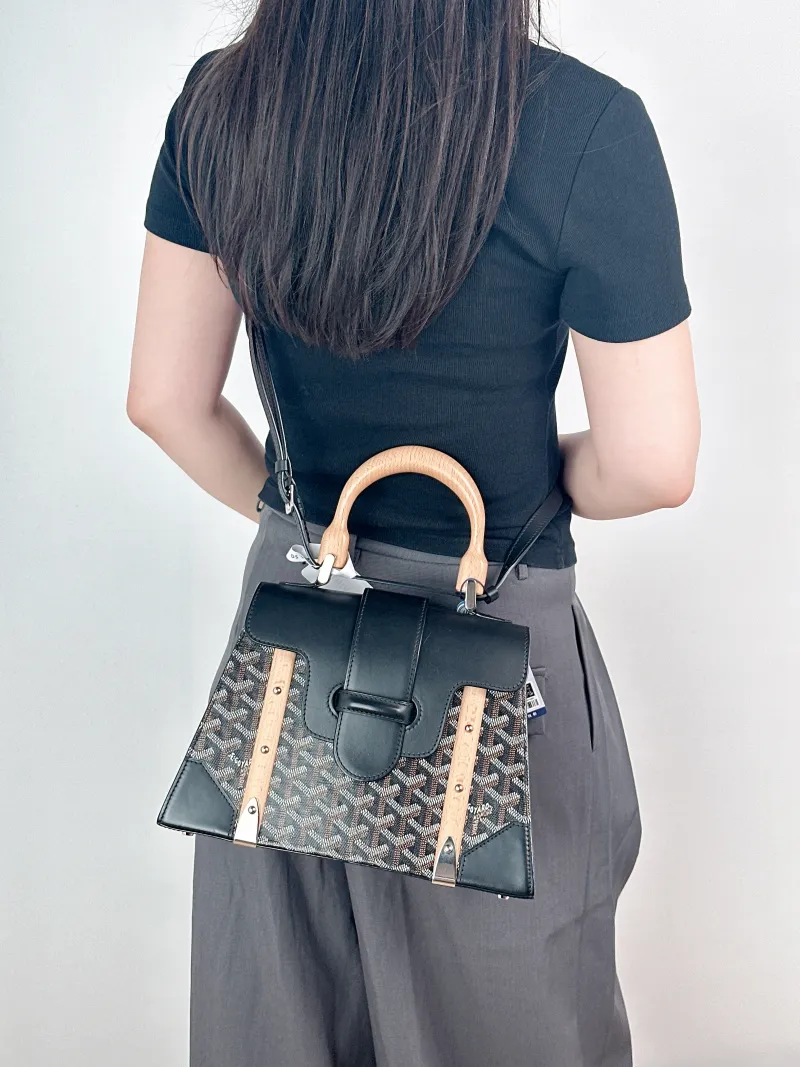 GOYARD Crossbody Bag Saïgon Black PVC Small28 × 12 × 20 cm — on-model view 1 of 2