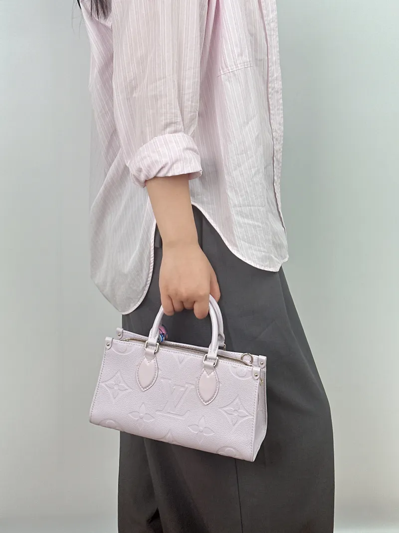 Louis Vuitton Crossbody Bag Onthego East West Two Straps Empreinte Embossed Calfskin Small 25 × 10 × 13 cm — on-model view 1 of 2