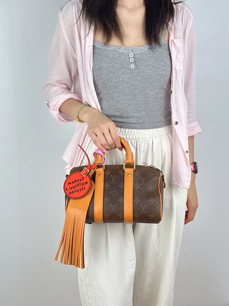 Louis Vuitton Crossbody Bag Keepall 25 Edition Brown PVC Medium25 × 11 × 15 cm — on-model view 2 of 3