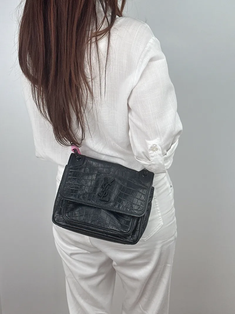 SAINT LAURENT Crossbody Bag Niki Black Waxed Leather Calfskin Small 21 × 7.5 × 16 cm — on-model view 2 of 2