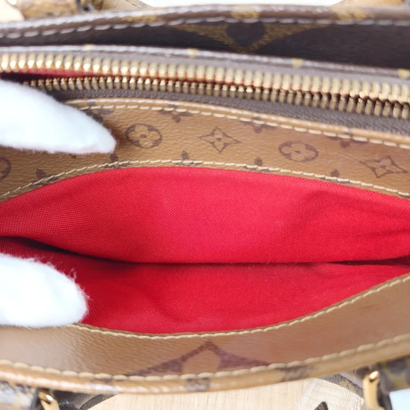 Louis Vuitton Crossbody Bag Onthego East West Monogram PVC Small 25 × 10 × 13 cm — detail view 10 of 11