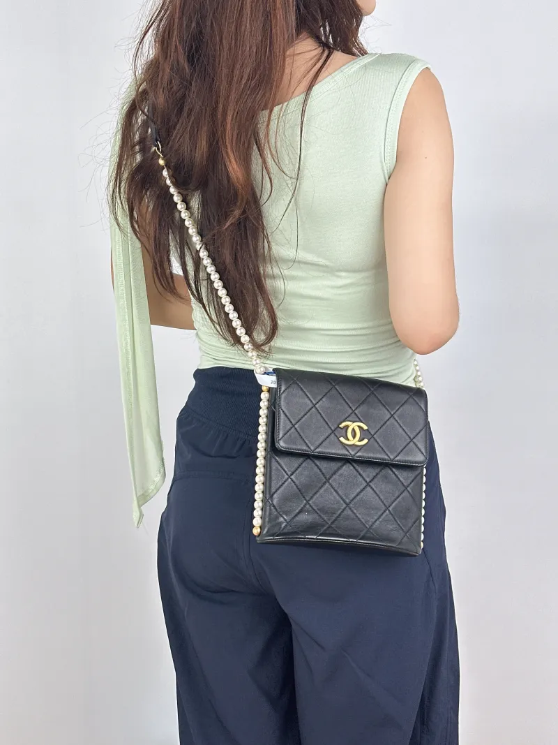 Chanel Crossbody Bag Pearl Crossbody Bag Black Calfskin One Size18.5 × 7.5 × 19 cm — on-model view 1 of 2