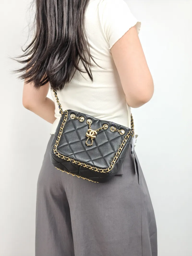 Chanel Shoulder Bag Bucket Bag Black Lambskin One Size 22 × 8 × 17 cm — on-model view 2 of 2
