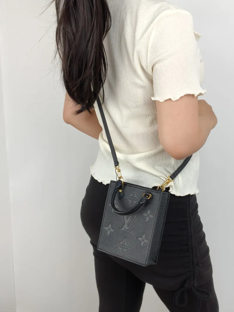 Louis Vuitton Crossbody Bag PETIT SAC PLAT Mini Black Calfskin Mini 14 × 5 × 17 cm — on-model view 2 of 2
