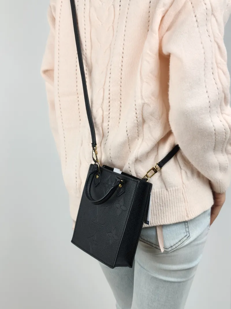 Louis Vuitton Crossbody Bag PETIT SAC PLAT Mini Black Calfskin Mini 14 × 5 × 17 cm — on-model view 1 of 2