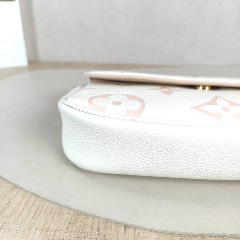 Louis Vuitton Crossbody Bag IVY White · Pink Monogram Empreinte Embossed Calfskin Small 23.5 × 4.3 × 12 cm — detail view 9 of 11