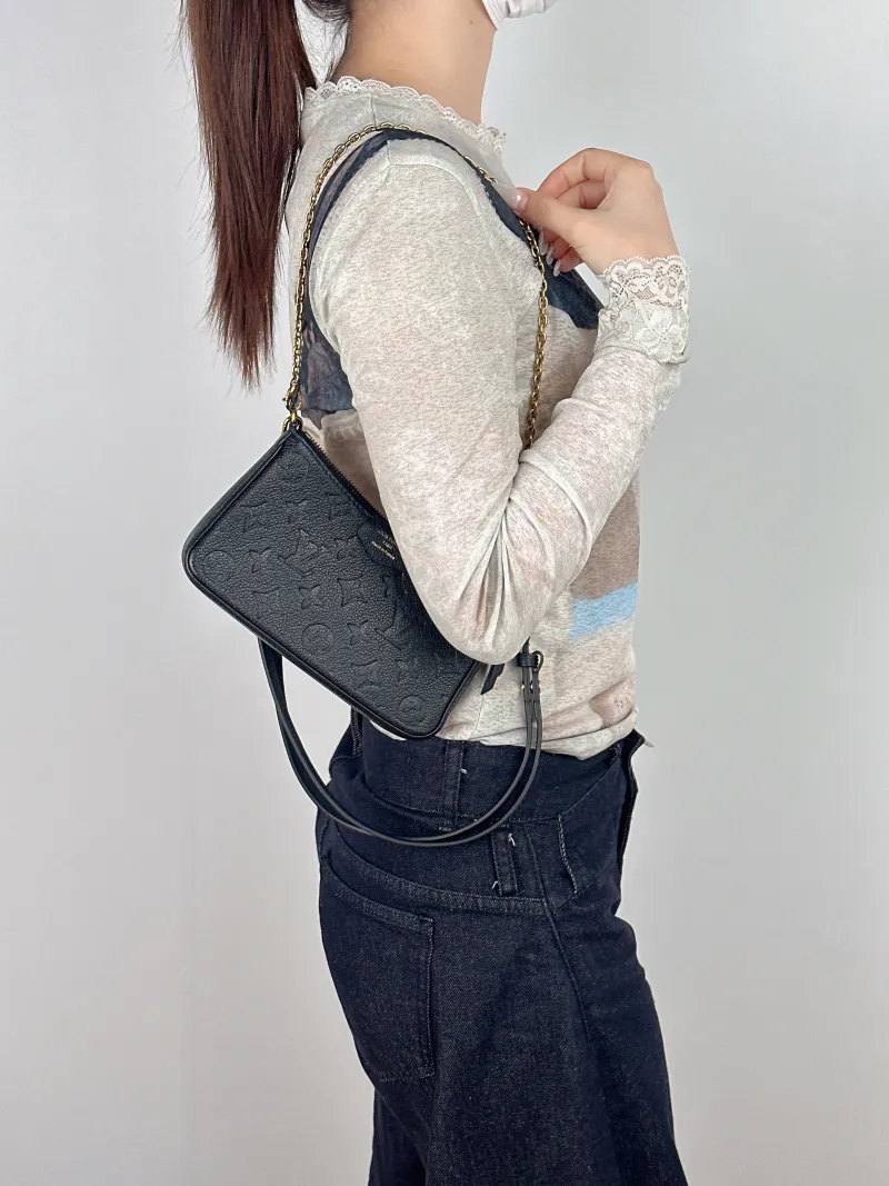 Louis Vuitton Crossbody Bag EASY POUCH ON STRAP Black Empreinte Embossed Calfskinmini19 × 3 × 11.5 cm — on-model view 2 of 2