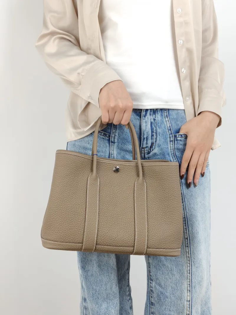Hermès Top Handle Bag Garden Party 30 30 Negonda Calfskin Medium 30 × 13 × 21 cm G — on-model view 1 of 2