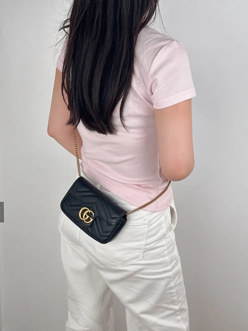 GUCCI Crossbody Bag GG Marmont Mini Marmont Mini Black Calfskinmini16.5 × 4.5 × 9.5 cm — on-model view 1 of 2