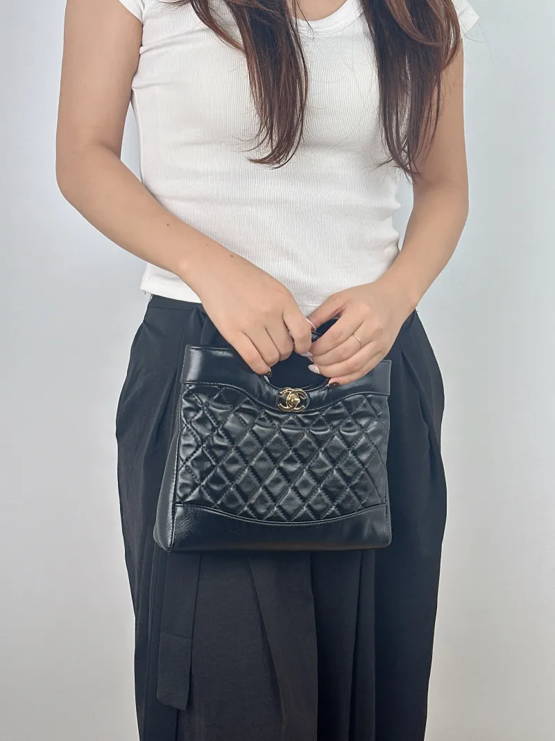 Chanel Crossbody Bag 31Bag Black Waxed Leather Mini 23 × 5.5 × 22 cm — on-model view 2 of 2