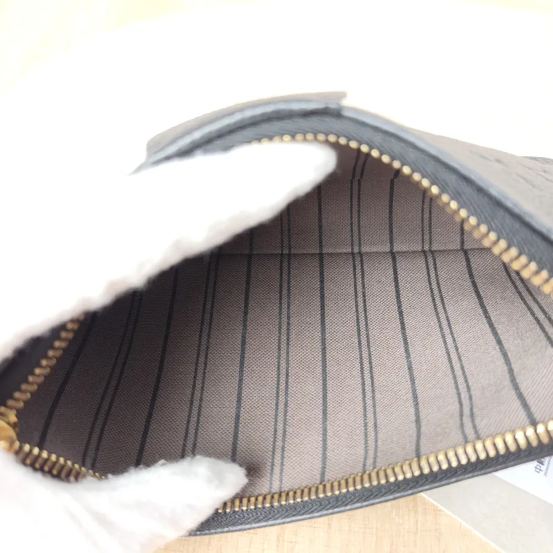 Louis Vuitton Crossbody Bag EASY POUCH ON STRAP Black Monogram Empreinte Embossed Calfskin Mini 19 × 3 × 11.5 cm — detail view 2 of 10
