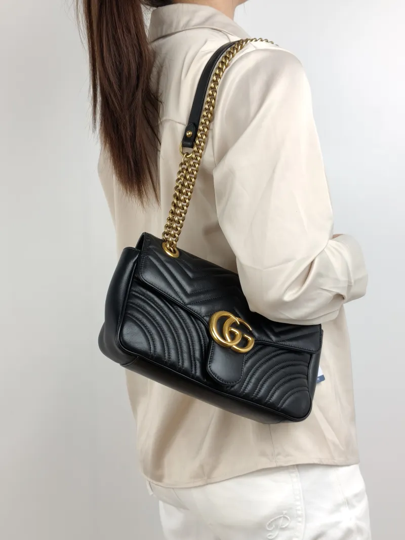 GUCCI Crossbody Bag GG Marmont Medium Marmont 26 Black CC alfskin Medium 26 × 7 × 15 cm — on-model view 2 of 2