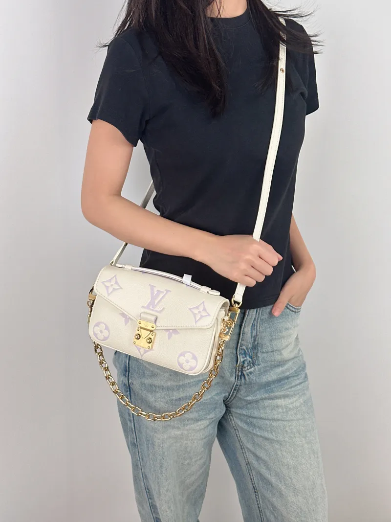 Louis Vuitton Crossbody Bag Pochette Métis East West White · Monogram Empreinte Embossed Calfskin Small 21.5 × 6 × 13.5 cm — on-model view 4 of 4