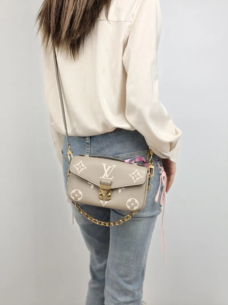 Louis Vuitton Crossbody Bag Pochette Métis East West Monogram Empreinte Embossed Calfskin Small 21.5 × 6 × 13.5 cm — on-model view 3 of 3