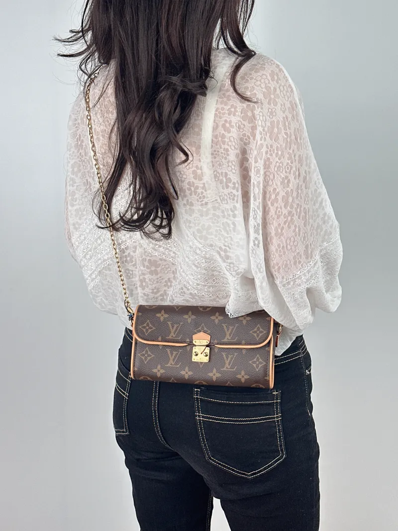 Louis Vuitton Crossbody Bag POCHETTE CAMILLE Monogram PVC One Size 20.5 × 6 × 11 cm — on-model view 1 of 2