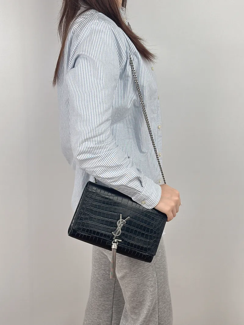 SAINT LAURENT Crossbody Bag KATE Edition Black Calfskin Medium24 × 5.5 × 14.5 cm — on-model view 1 of 2
