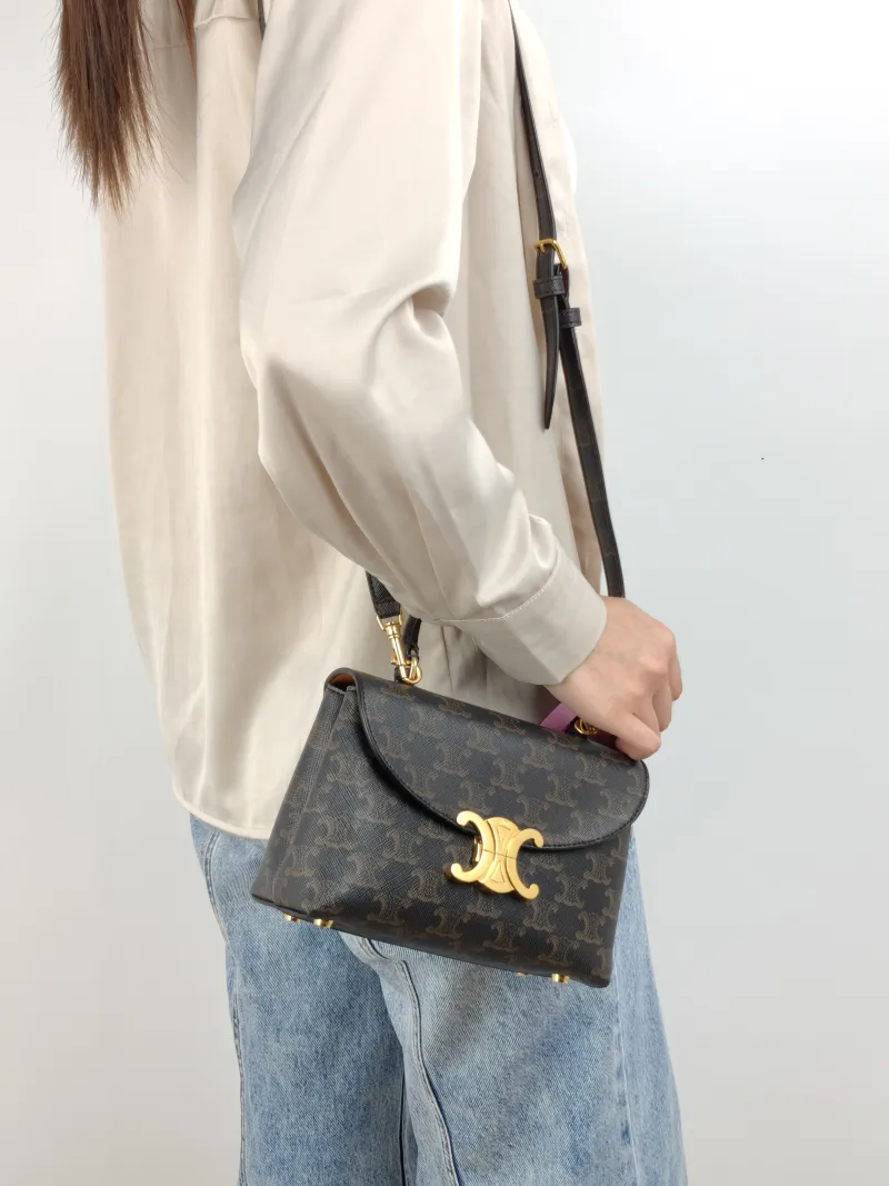 CELINE Top Handle Bag TEEN NINO Top Handle Bag Monogram PVC Small 20 × 8 × 13 cm — on-model view 1 of 3