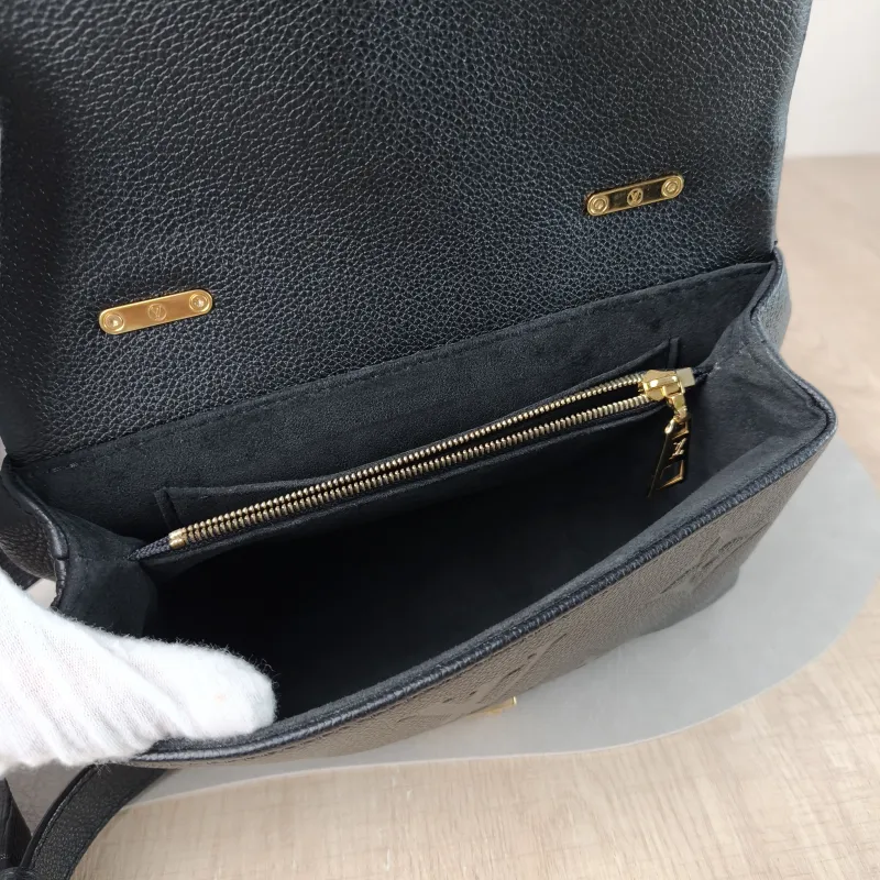Louis Vuitton Crossbody Bag MADELEINE Black Empreinte Embossed Calfskin BB 24 × 8.5 × 17 cm — detail view 12 of 12