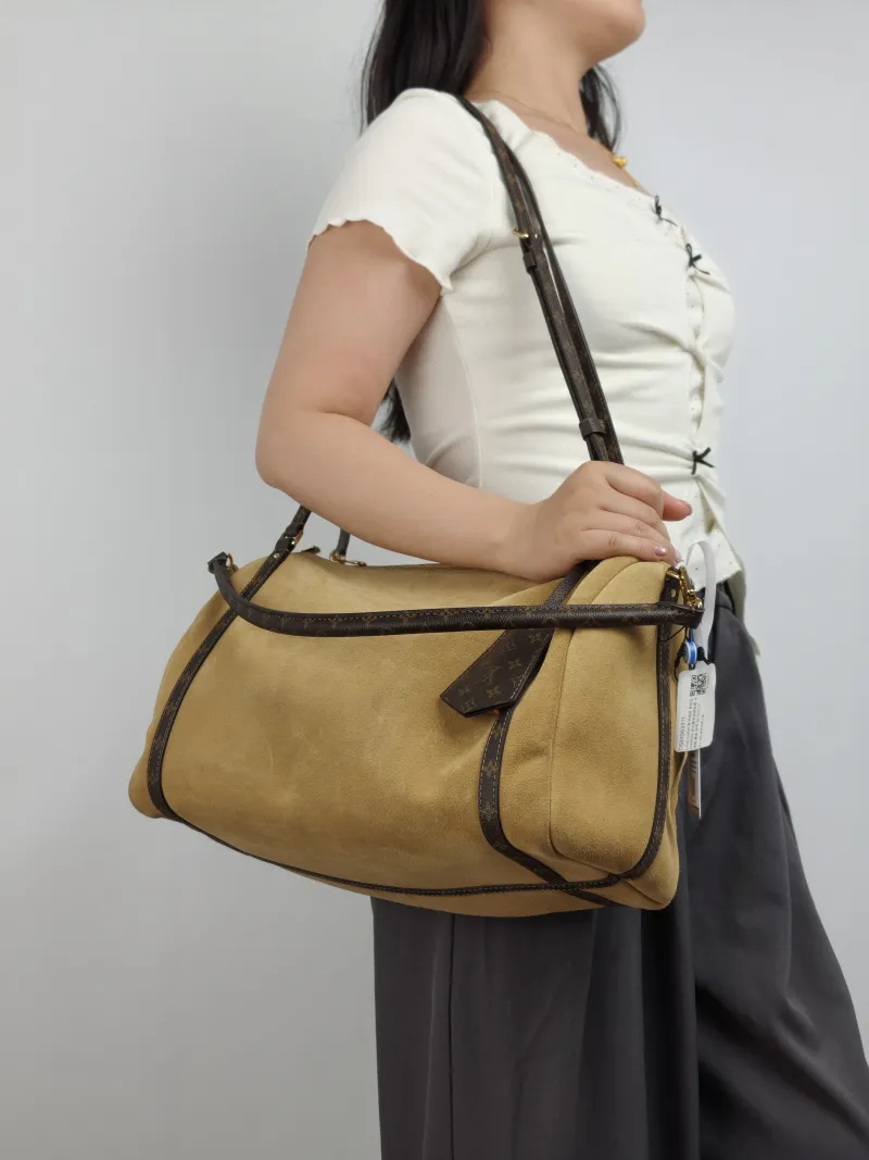 Louis Vuitton Shoulder Bag EXPRESS Shoulder Bag Suede Medium 36 × 18.5 × 24 cm — on-model view 1 of 2