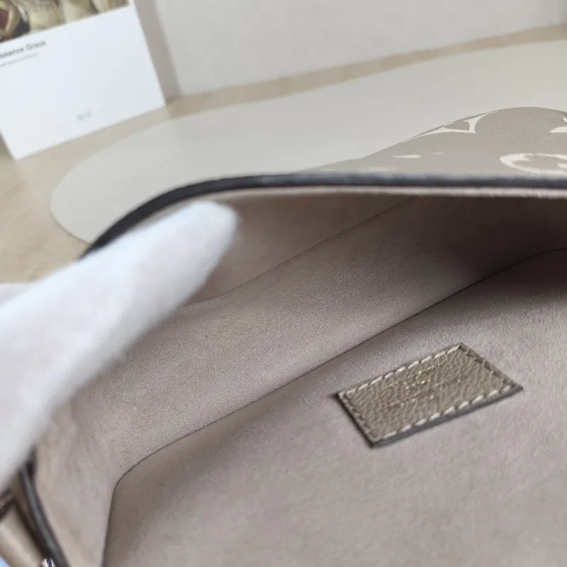 Louis Vuitton Crossbody Bag Diane Baguette Bag Empreinte Embossed Calfskin nano 19 × 6 × 10.5 cm — detail view 8 of 12