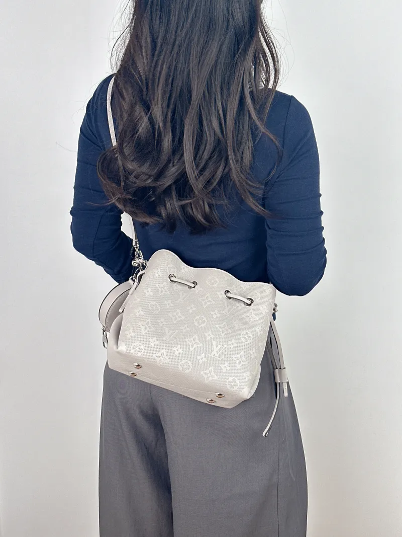 Louis Vuitton Crossbody Bag BELLA Grey Calfskin One Size 22 × 14 × 19 cm — on-model view 1 of 2